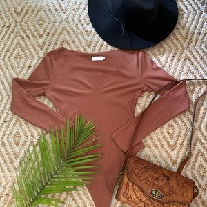 Meshki Clay colored bodysuit.